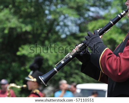 Marching Band Performer Playing Clarinet in Parade, Copy Space, vertical