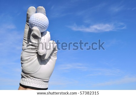Golfer Wearing Golf Glove Holding a Golf Ball