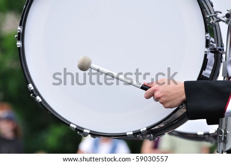 Drummer Playing A Bass Drum in Parade