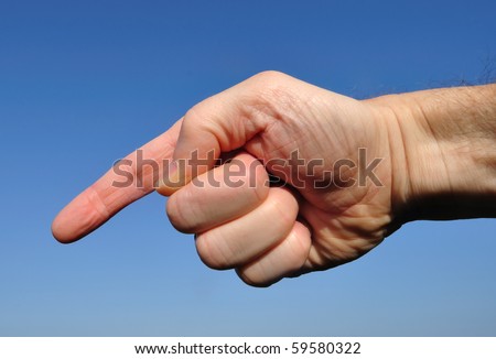 Hand Pointing Down Against a Blue Sky