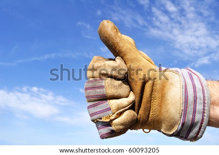 Worker Wearing Leather Work Glove Giving the Thumbs Up Sign