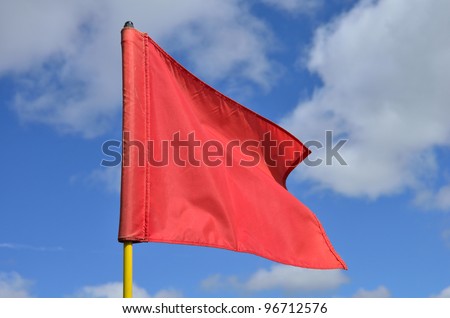 Red Golf Flag Waving in the Breeze
