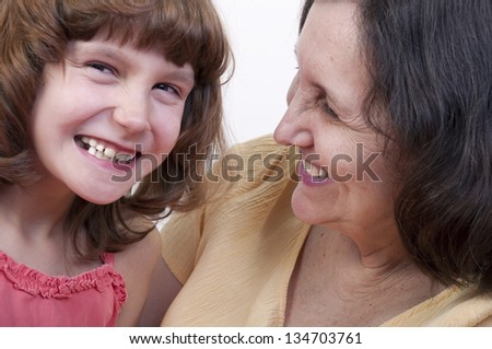 close-up portrait of happy smiling grandmother and granddaughter