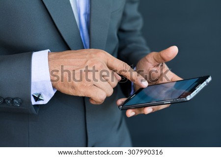Professional businessman using a smart mobile phone