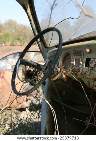 stock photo : Rusty car at junkyard