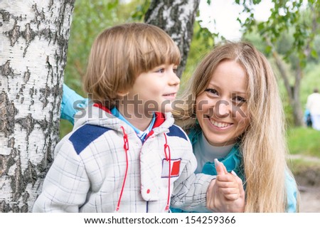 Happy family in the forest, focus on mother