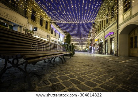 Brasov, Transylvania, Romania - December 28, 2014: A view of one of the main streets in downtown Brasov with Christmas lights