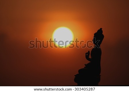 lord Buddha silhouette at sunset