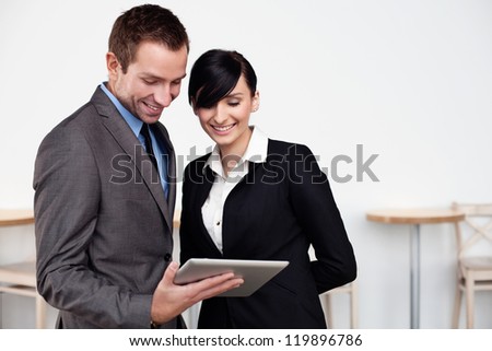 Happy Business people with digital tablet.