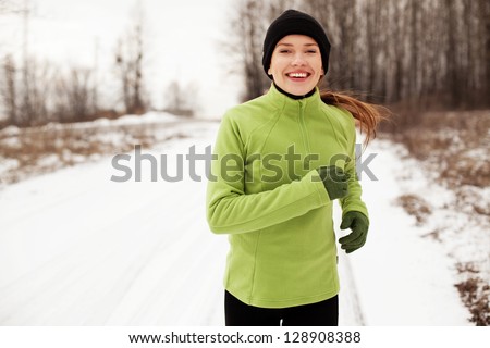 Happy Woman Running In Winter