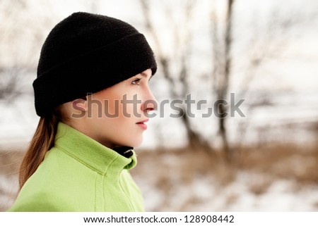 Woman preparing to run in winter