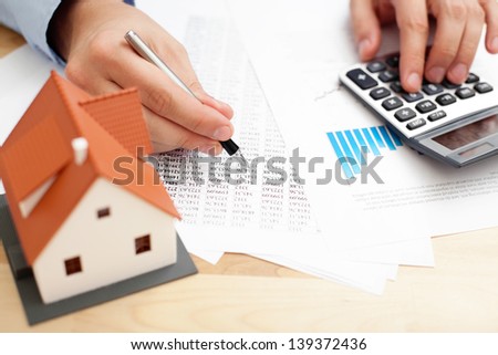 Closeup of man counting payments for home
