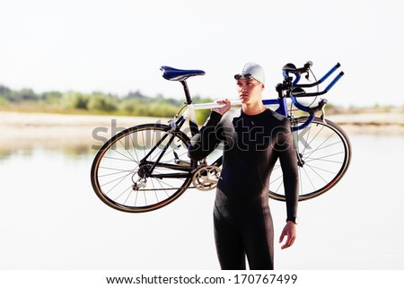 Triathlonist preparing for the bike race Triathlonist preparing for the bike race