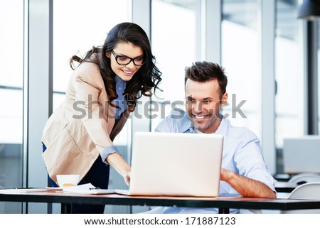 Business Partners At Front Of A Laptop