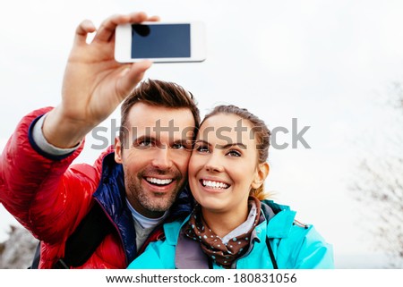 Young couple taking a selfie during a hike