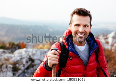 Portrait of a young man hiking in the mountains