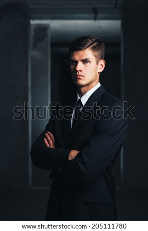 Portrait of a decisive professional against a concrete background