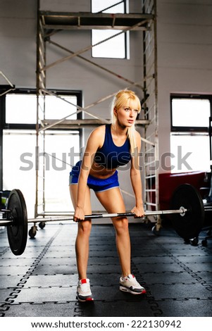 Photo of a female bodybuilder performing deadlift