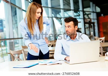 Businesspeople having an argument in an office