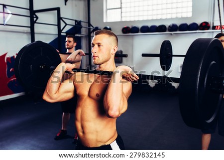 Group of man training Clean and jerk workout with barbells