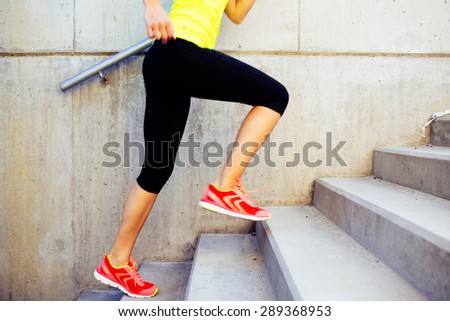 Woman running up the stairs, interval training