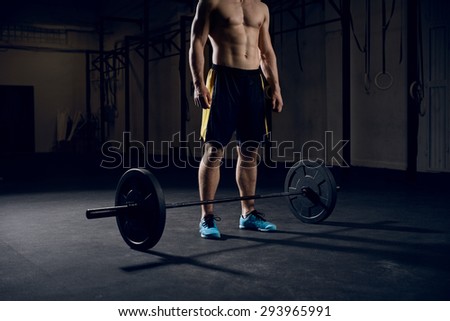 Closeup of athlete preparing for barbells exercise