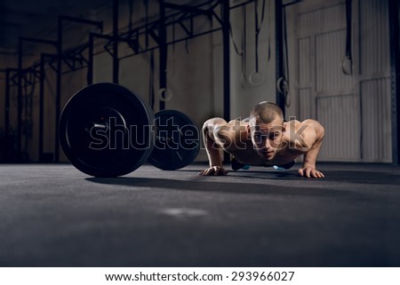 Man making burpees during strength training