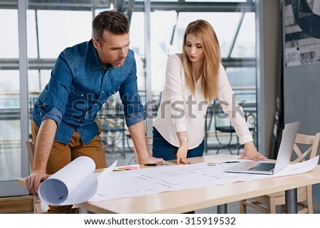 Two architects working on new design at modern office