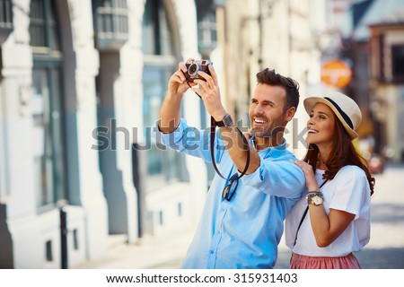 Tourists taking photo in the city
