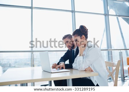 Business meeting of two partners at modern office