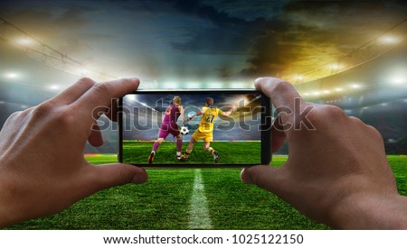 Football fan removes the football game on mobile phone