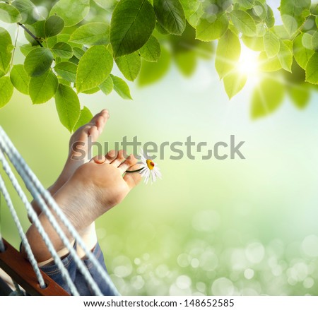 Relax in nature. Feet close up in a hammock