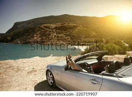 Women traveling in a convertible on Resorts