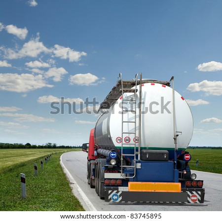 new truck with tank trailer driving the highway
