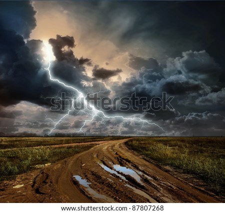 Countryside landscape with dirt road after rain, Russia