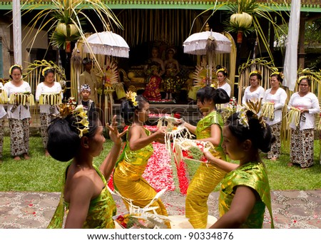 BALI, INDONESIA - NOV 24: Traditional wedding ceremony on November 24, 2010 in Bali, Indonesia. The ceremony takes place in old royal palace and all vilagers participate in the ceremony