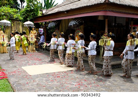 BALI, INDONESIA - NOV 24: Traditional wedding ceremony on November 24, 2010 in Bali, Indonesia. The ceremony takes place in old royal palace and all villagers participate in the ceremony