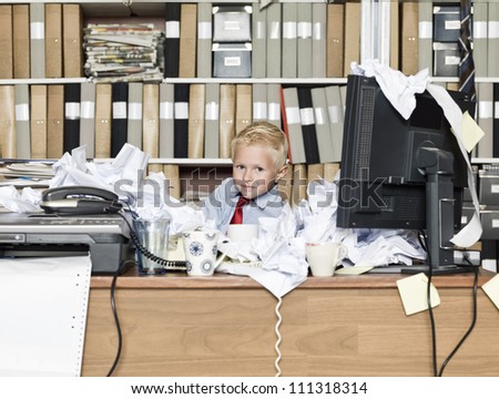 Young business man in a messy office