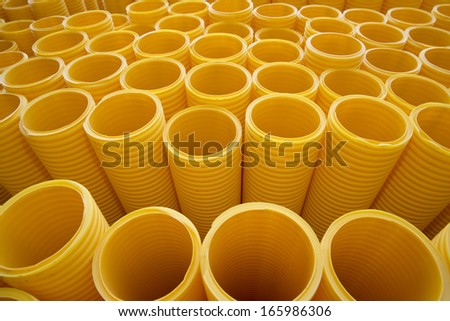 Yellow plastic pipes full frame
