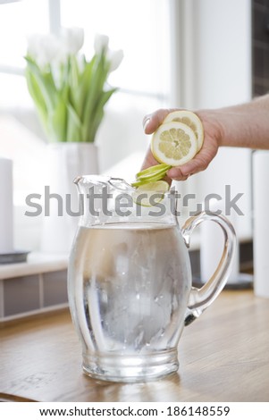 Water carafe with lemon and lime