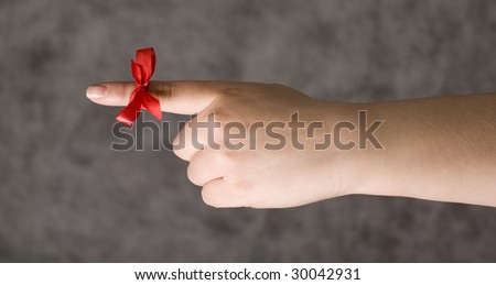 Red string around the finger as a reminder