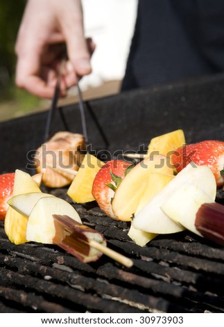Barbecue fruit skewer on the grill