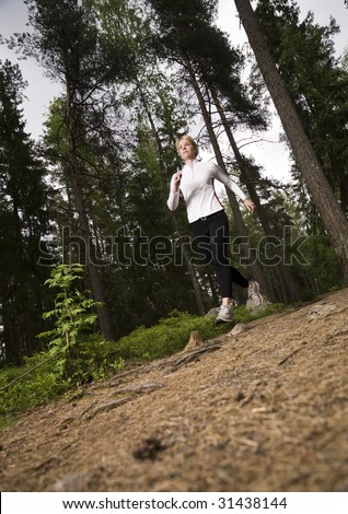 Woman running in the woods