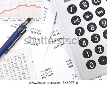Office supplies, including calculator, pen and papers.