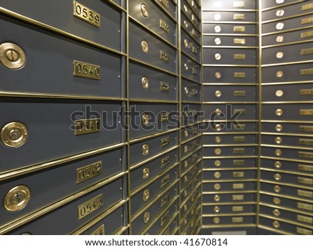 Rows of luxurious safe deposit boxes in a bank vault