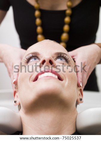 Woman washing at the hair salon