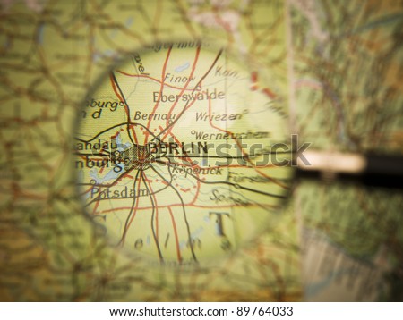 Magnifying Glass in front of a Berlin map