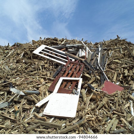 Heap of Wood Garbage in front of blue sky
