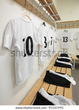 Soccer teams dressing room with numbered shirts