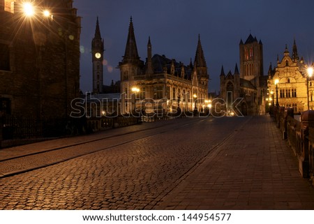 View from Saint Michael's Bridge towards the towers of Ghent : the Saint Nicholas' church and the Belfry of Ghent.  The tower left is the old Post Office.